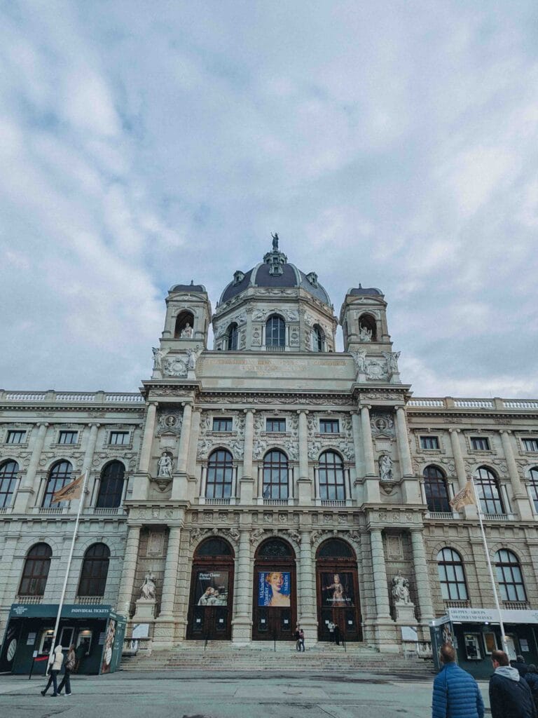 The grand, Neo-Renaissance exterior of the Kunsthistorisches Museum (Museum of Art History) in Vienna, featuring an ornate facade and a central dome.