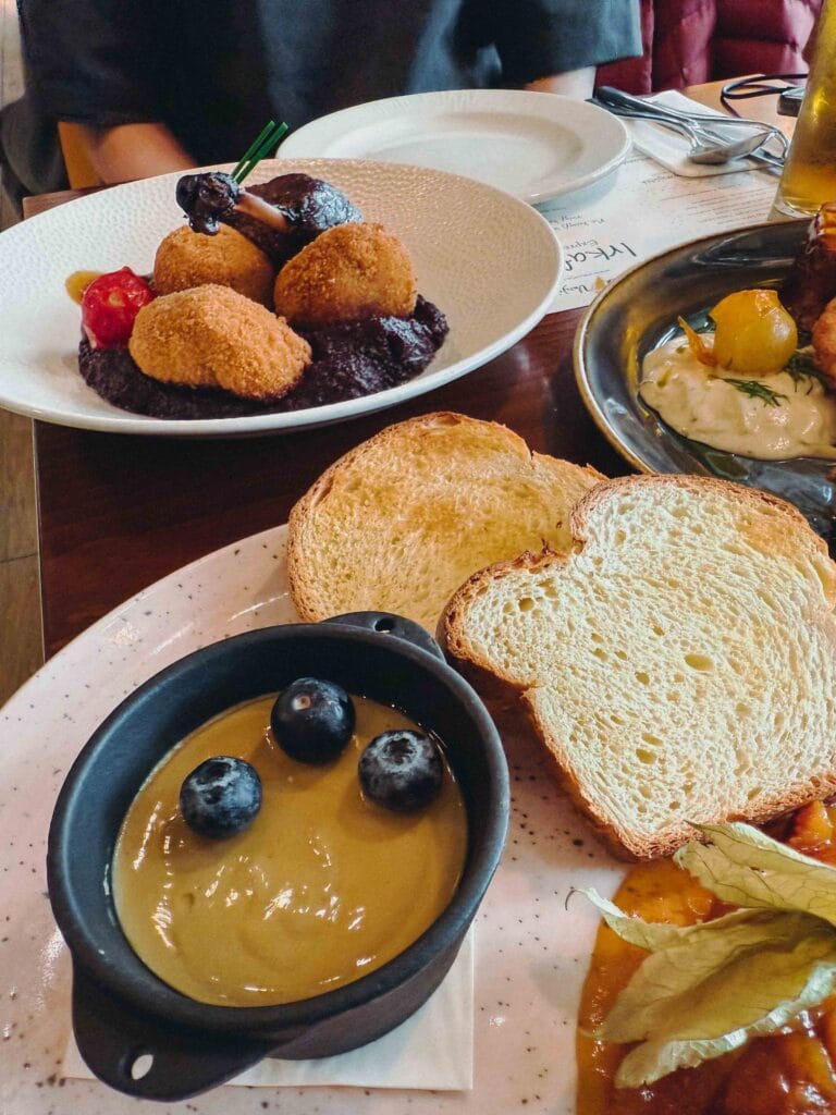 A delicate appetizer of smooth duck liver mousse topped with clear elderflower jelly, served with apricot chutney and slices of toasted milk loaf.