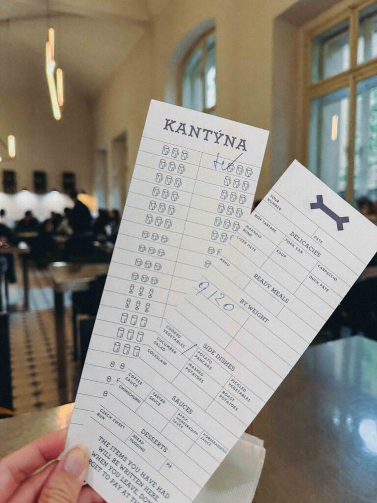 A close-up of the signature paper tally card used to track food and drink orders at Kantýna.