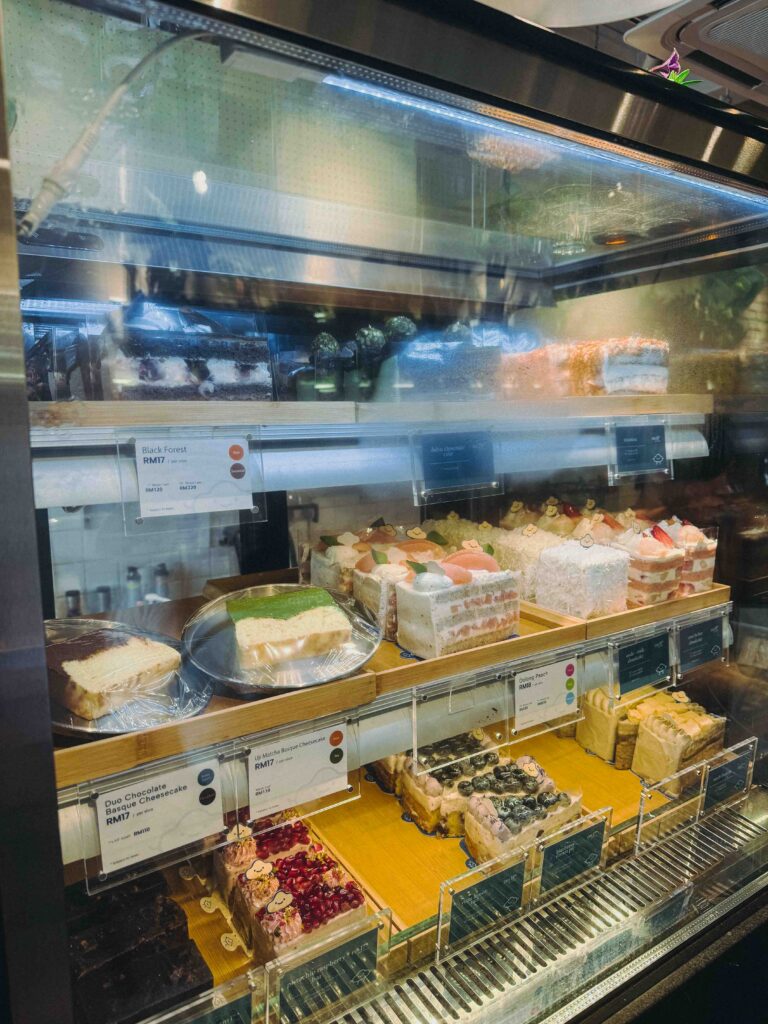 Cake display cabinet at Fluffed Cafe Petaling Jaya with Basque cheesecakes and seasonal slices
