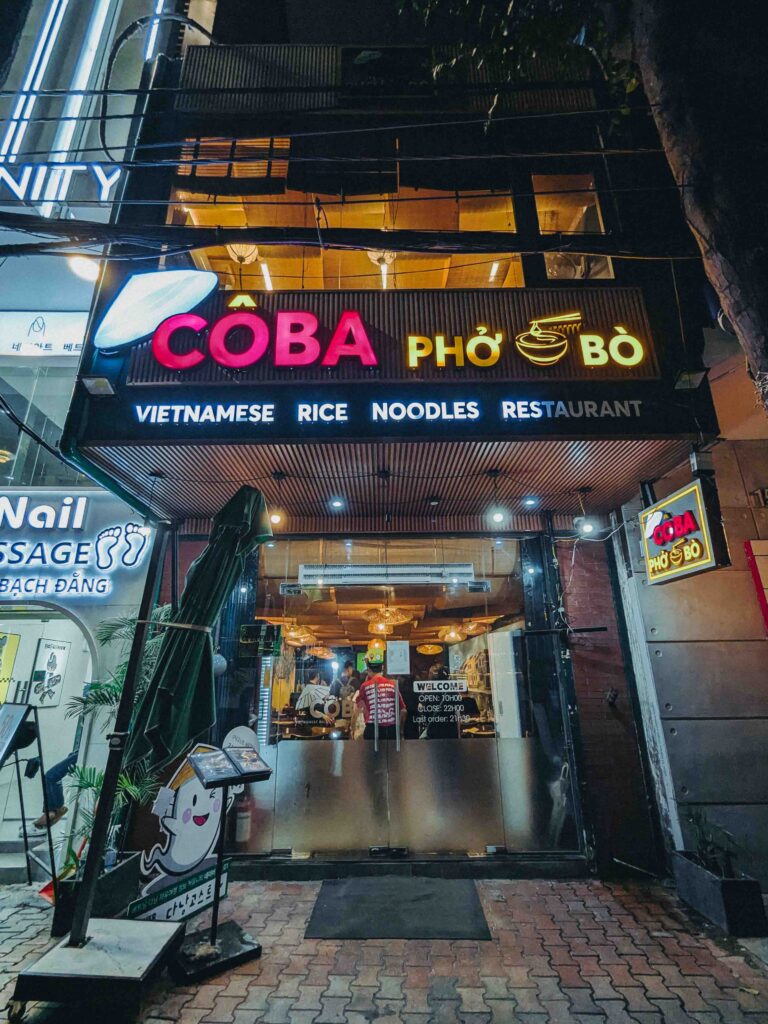 Co Ba Pho Bo Vietnamese rice and noodles restaurant exterior at night in Da Nang