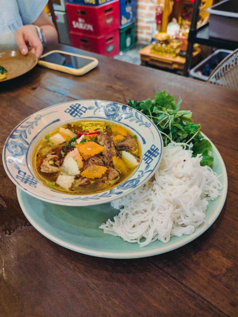 Grilled pork with fresh rice noodles, pickled vegetables, fresh herbs and dipping sauce served at Cơm Linh Hội An