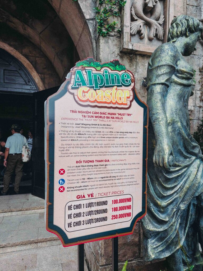 Alpine Coaster attraction sign at Ba Na Hills showing ticket prices and ride specifications in Vietnamese and English