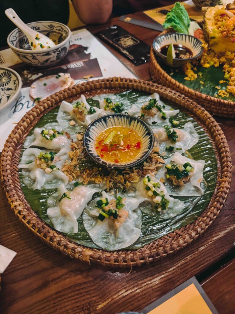White rose dumplings (Bánh Bao Vạc) arranged on a banana leaf with a chilli dipping sauce at Ăn Thôi Da Nang